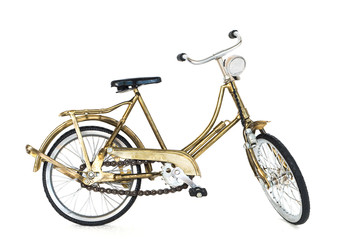 Fototapeta premium Small gold color toy bicycle