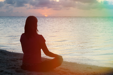 woman meditation on the beach