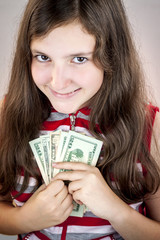 Teenage girl holding money