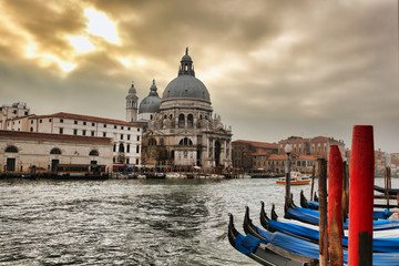 Fototapeta premium Venice with gondolas against sunset in Italy
