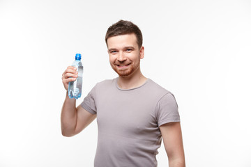 man in jeans and a T-shirt with bottle of water