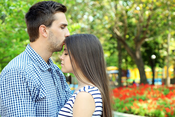 Fototapeta premium Embrace a loving couple outdoors