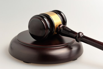 Hammer of judge on gray background closeup