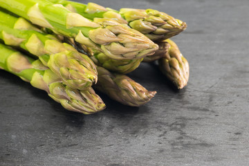 green asparagous on a slate plate