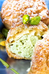 Pistachio dessert with Pistachios Cream. Profiteroles with Pista