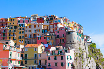 Fototapeta na wymiar Multi-colored houses in Manarola. Laguria, Italy