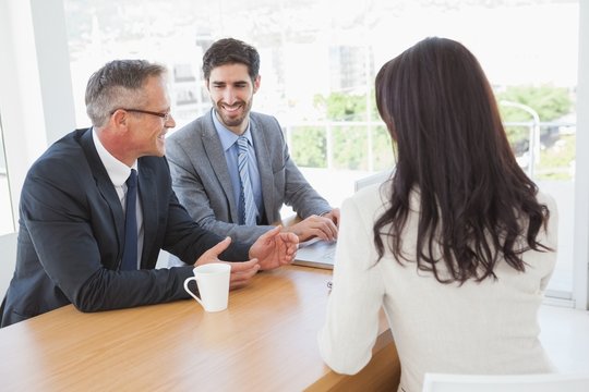 Happy business team talking together