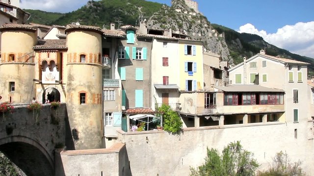 People walking in the entrance of the medieval city of Entrevaux