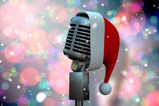 Composite image of microphone with santa hat