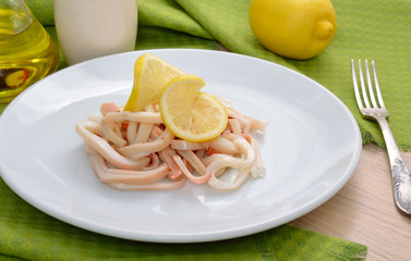 Boiled squid with a lemon