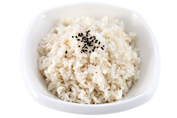Boiled rice in a deep plate, isolated on white.