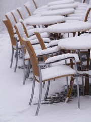 snowy chairs tables winter