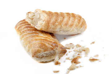 home made sausage rolls on bright background