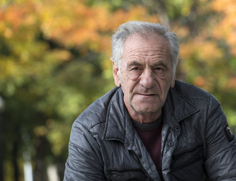 Handsome Old Italian Man In A Park At Fall