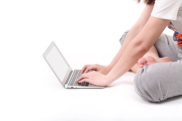 Fototapeta premium Hands on the laptop computer isolated on white.