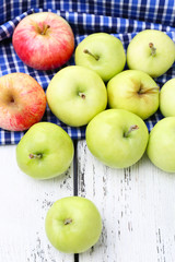 Ripe apples on wooden table close-up