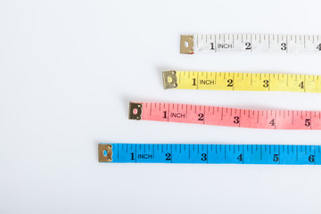 Four colorful  measuring tapes