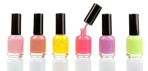 Colorful nail polishes isolated on white