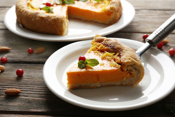 Homemade pumpkin pie on table