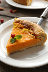 Homemade pumpkin pie on table