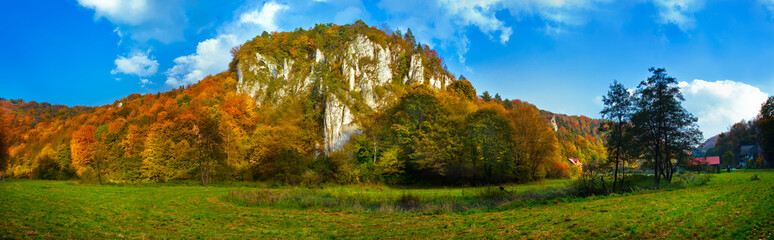 Autumn panoramic view of the limestone cliffs in the park