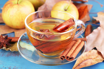 Composition of  apple cider with cinnamon sticks, fresh apples