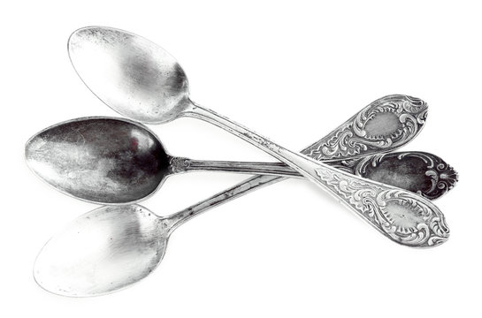 Three tablespoons isolated on white