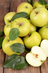 Ripe green apples on wooden background