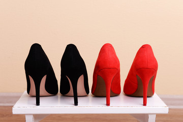 Red and black women shoes in room