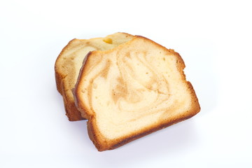 Caramel and sweet fruit pound cake on white background