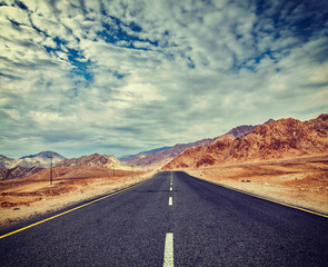 Road  in Himalayas with mountains