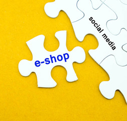 Jigsaw puzzle with e-shop and social media word