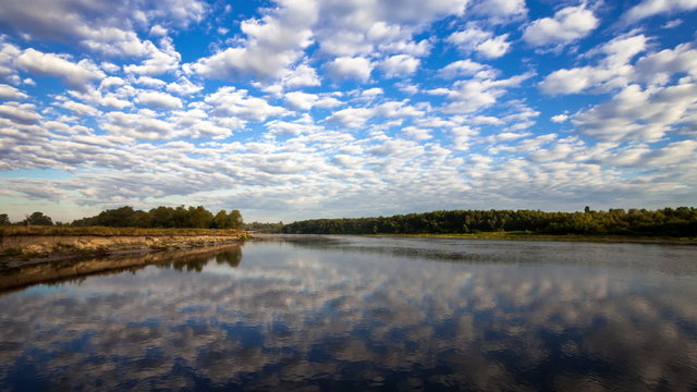 Beautiful clouds reflected in the river. 