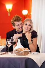 Pretty Young Couple having Date at Restaurant.