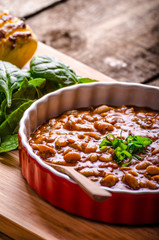 Spicy cowboy beans with hassleback potatoe with herbs