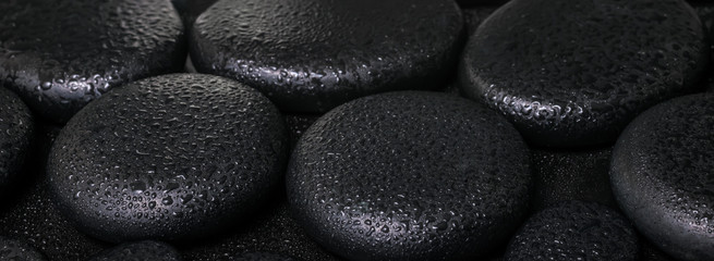 Obraz na płótnie Canvas beautiful spa concept of zen basalt stones with dew, closeup