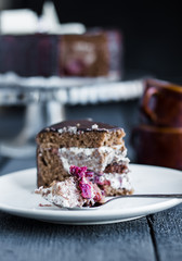eating chocolate cake with butter cream and cherries, birthday