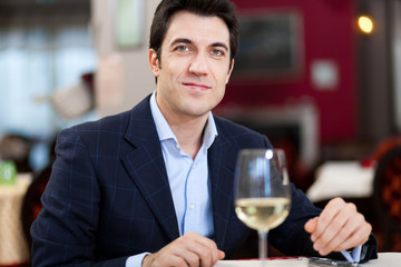 Handsome man with a glass of wine