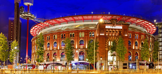 Plakat Old Arena building in Barcelona, Catalonia, Spain. Night view.