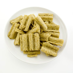 corn flake cereal in a pile isolated against a white background