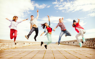 group of teenagers jumping