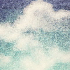 Vintage background in the blue shade with clouds