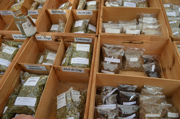 boxes with medicinal herbs on market