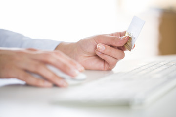 Woman is shopping on the internet with credit card