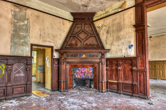 Massive fireplace in an abandoned mansion