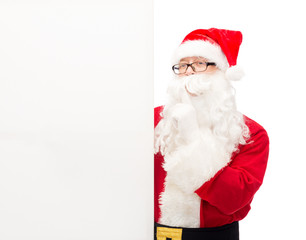 man in costume of santa claus with billboard