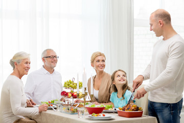 smiling family having holiday dinner at home