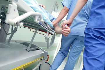 Work with the patient in a hospital corridor