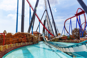 Fototapeta na wymiar Roller Coaster in funny amusement park