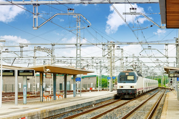 Fototapeta na wymiar Modern high speed train at the railways stantion.